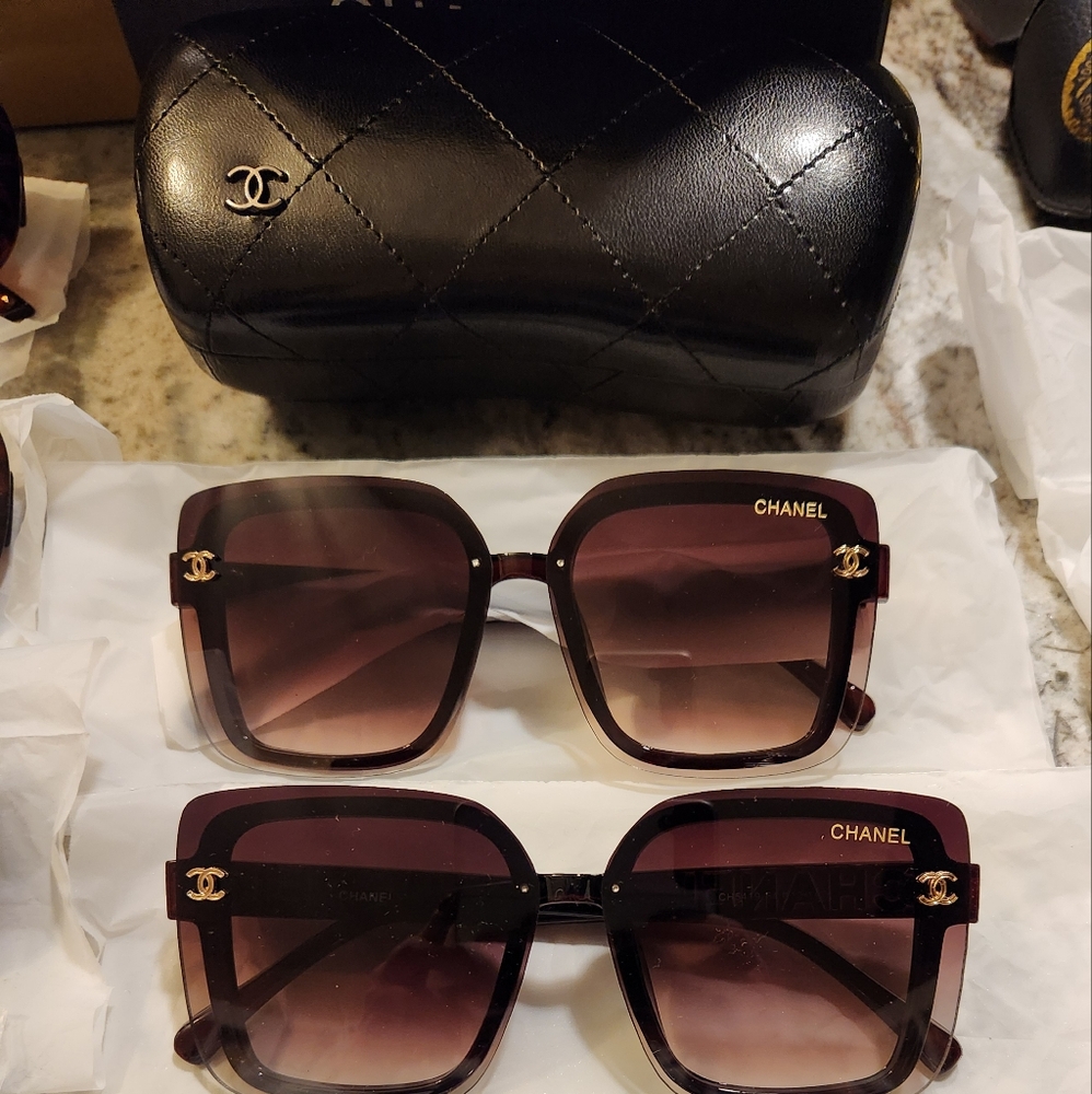 Beautiful  sunglasses! 1 black pair & 1 brown available